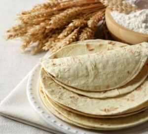 A plate stacked with tortillas